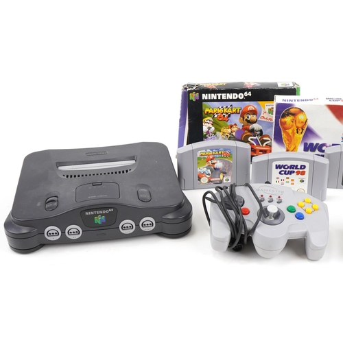 652 - Nintendo 64 games console with controllers and games including Mario Kart 64 and Mission Impossible