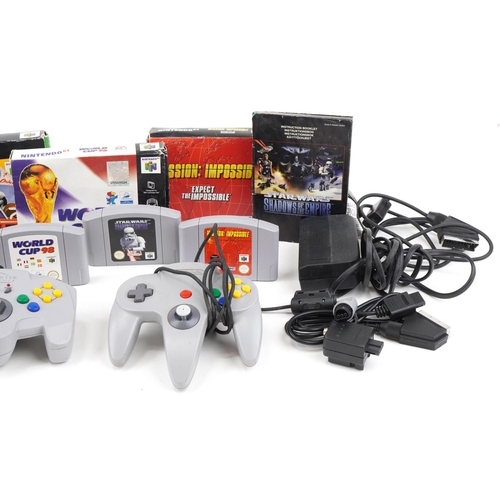 652 - Nintendo 64 games console with controllers and games including Mario Kart 64 and Mission Impossible