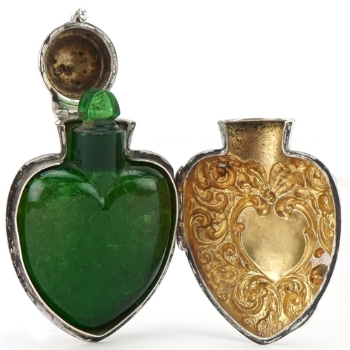 313 - Henry Matthews, Victorian silver scent bottle case in the form of a love heart housing a green glass... 