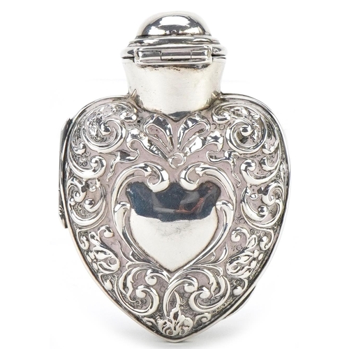 313 - Henry Matthews, Victorian silver scent bottle case in the form of a love heart housing a green glass... 