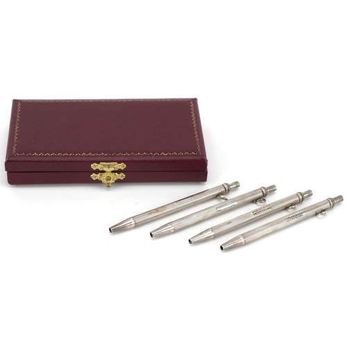 2438 - Set of four sterling silver engine turned bridge marker pens with fitted case, each 9cm high, total ... 