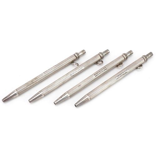 2438 - Set of four sterling silver engine turned bridge marker pens with fitted case, each 9cm high, total ... 