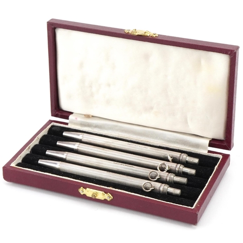 2438 - Set of four sterling silver engine turned bridge marker pens with fitted case, each 9cm high, total ... 