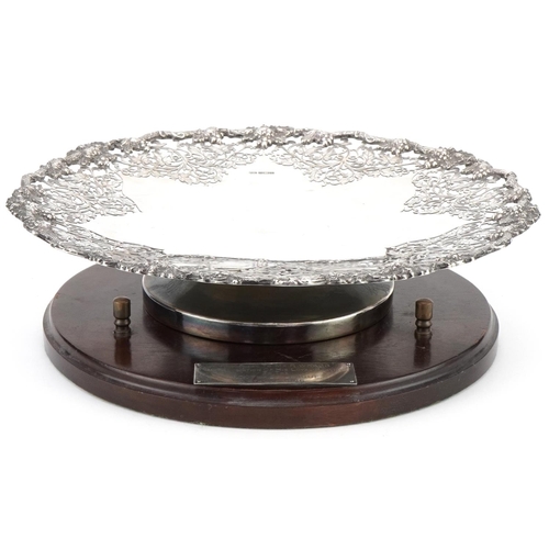 Parkin Silversmiths Ltd, Elizabeth II silver pedestal tazza cast and pierced with grapevine, raised on a hardwood stand with Football League 4th July 1986 presentation plaque, the tazza Sheffield 1978, 30cm in diameter, weighable silver 946.0g