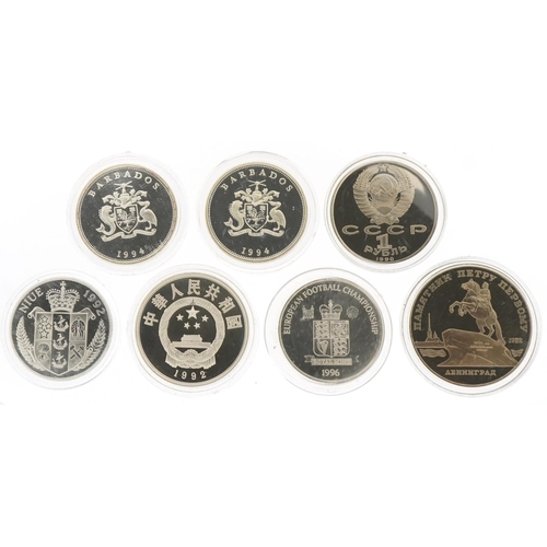 1276 - Five commemorative silver coins and two Russian coins, the silver coins to include Queen Elizabeth T... 