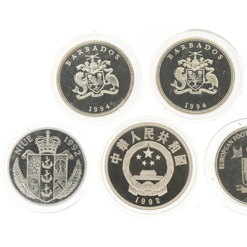 1276 - Five commemorative silver coins and two Russian coins, the silver coins to include Queen Elizabeth T... 