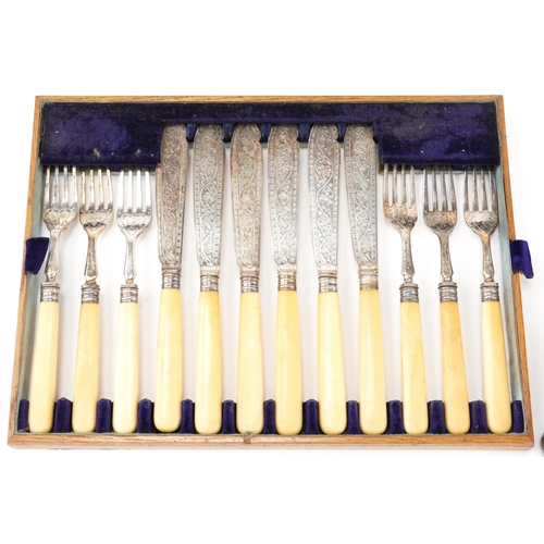 386 - Oak canteen of twelve silver plated fish knives and forks with ivorine handles, the canteen 35cm wid... 