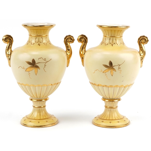 1094 - Pair of Victorian aesthetic twin handled porcelain vases hand gilded with flowers, each 36cm high