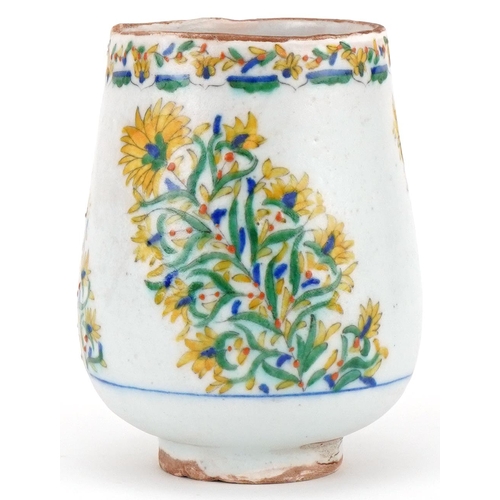 121 - Ottoman Turkish Kütahya wine cup hand painted with sprays of flowers, 13cm high