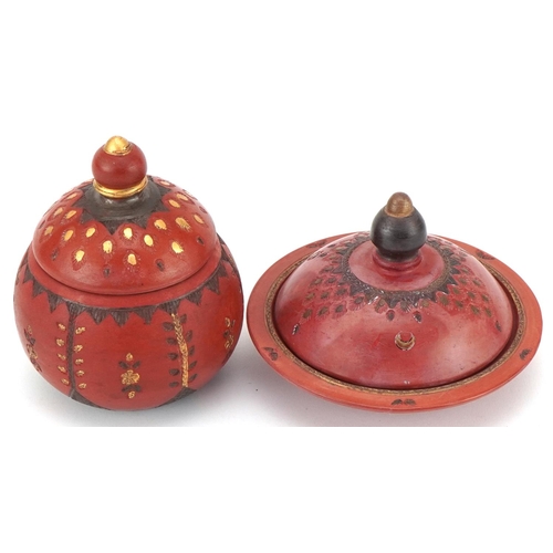 226 - Two Turkish Tophane pottery bowls and covers decorated with flowers, the largest 12cm high