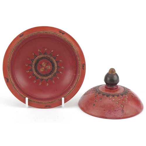 226 - Two Turkish Tophane pottery bowls and covers decorated with flowers, the largest 12cm high