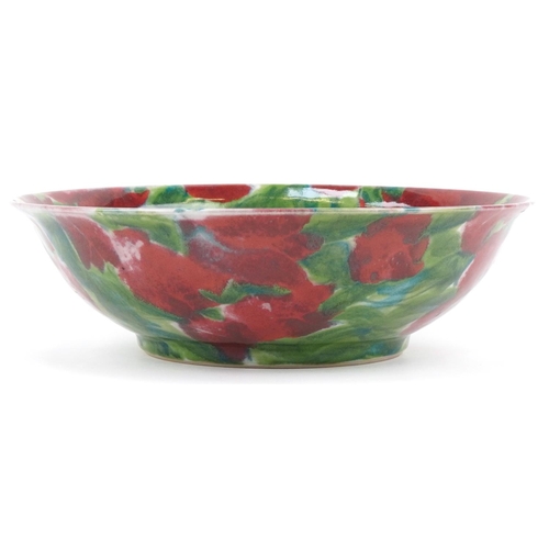 338 - Janice Tchalenko for Dartington Pottery bowl hand painted with an abstract poppy design, 35cm in dia... 