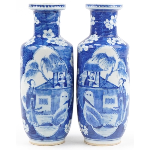 Pair of Chinese blue and white porcelain vases hand painted with lovers scenes and prunus flowers, character mark to the base, each 30cm high