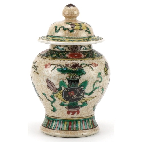 427 - Chinese pottery ginger jar hand painted with a basket of flowers, 22cm high