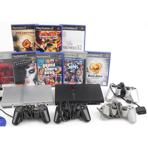 636 - Two Sony PlayStation 2 Slim games consoles with controllers and a collection of games