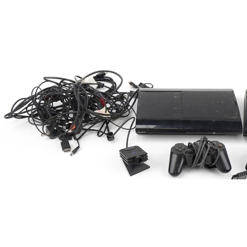 639 - Two Sony PlayStation 3 games consoles with two controllers
