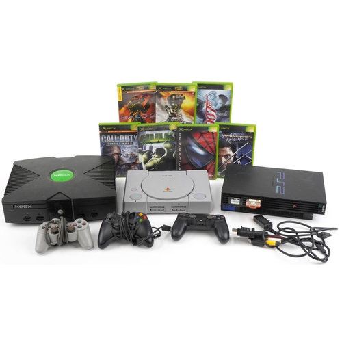 641 - Three games consoles comprising Xbox with controller and a collection of games, PlayStation 2 with c... 