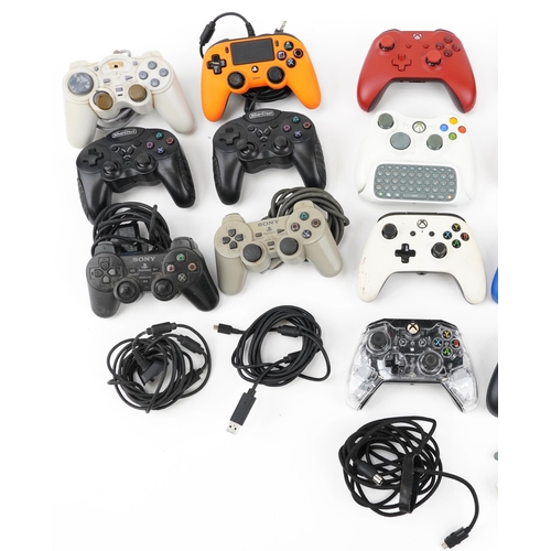 637 - Large collection of Xbox and PlayStation games console controllers