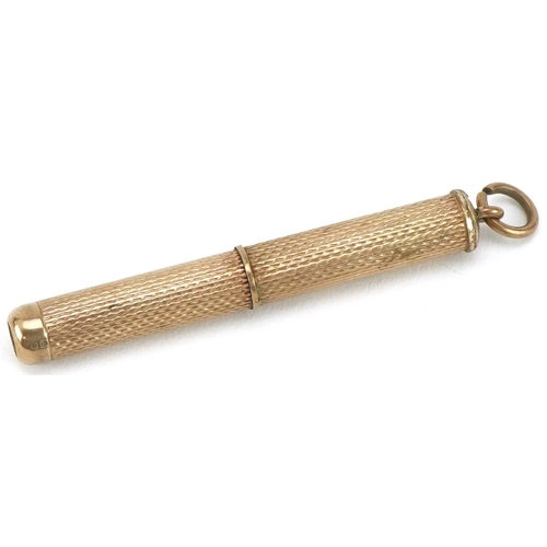 307 - 9ct gold propelling toothpick, 7cm in length when extended, 5.6g