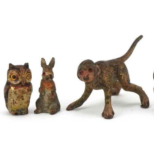 299 - Four miniature cold cast bronze animals and one other including monkey, owl and rabbit, the largest ... 