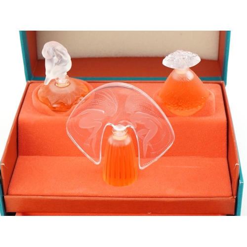 390 - Lalique - The Special Ultimate Collection, five miniature Lalique glass scent bottles and contents w... 