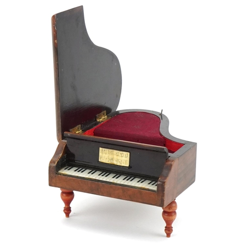 137 - Rouge music box in the form of a grand piano, 17cm in length