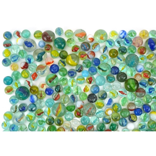 555 - Collection of vintage and later glass marbles including cat's eye and milk glass examples