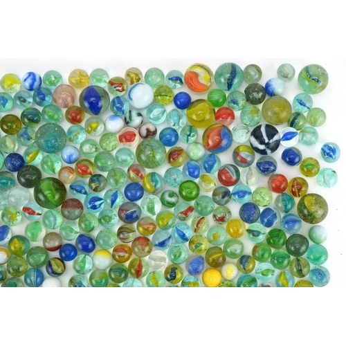 555 - Collection of vintage and later glass marbles including cat's eye and milk glass examples