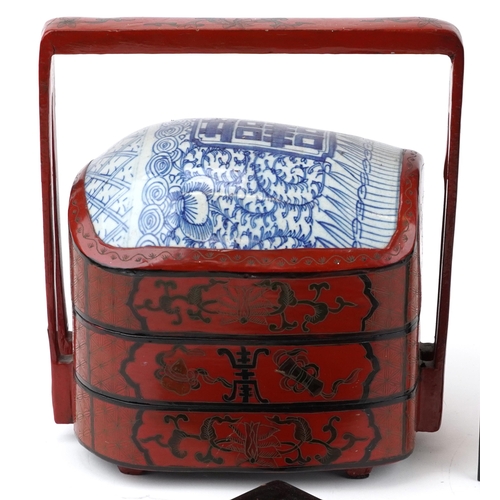 436 - Chinese and Japanese sundry items including a red lacquered three section food carrier, black lacque... 