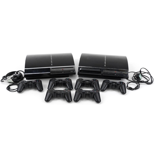 638 - Two Sony PlayStation 3 games consoles with six controllers