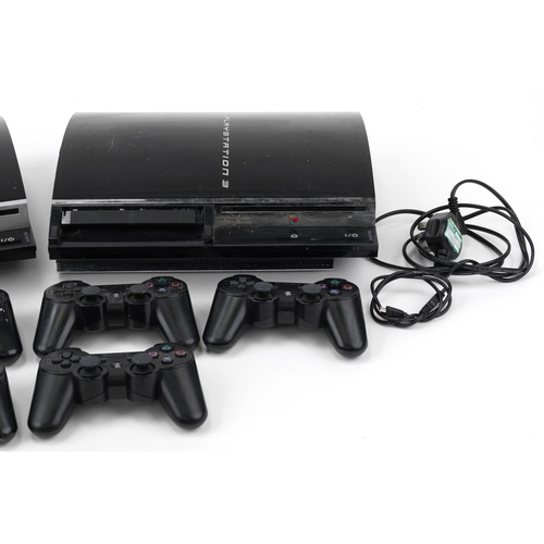 638 - Two Sony PlayStation 3 games consoles with six controllers