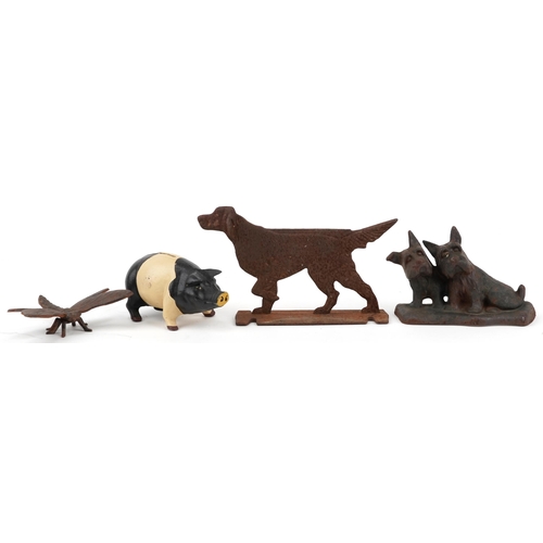 1192 - Cast iron animals including two dog doorstops and a pig money box, the largest 30cm in length