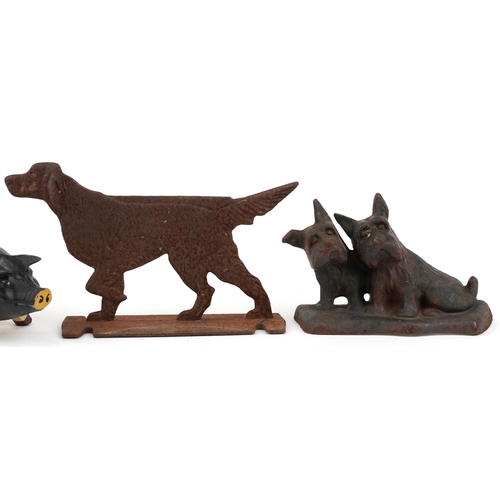 1192 - Cast iron animals including two dog doorstops and a pig money box, the largest 30cm in length