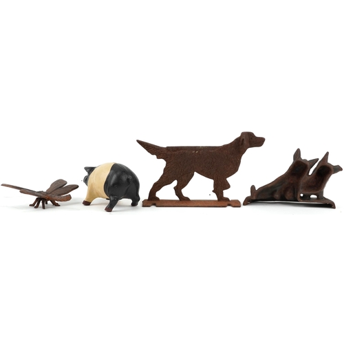 1192 - Cast iron animals including two dog doorstops and a pig money box, the largest 30cm in length