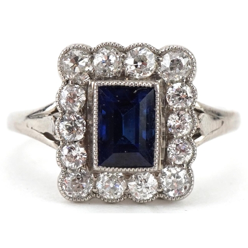Art Deco style unmarked white gold sapphire and diamond cluster ring, the sapphire approximately 6.0mm x 4.60mm x 3.80mm deep, each diamond approximately 2.20mm in diameter, size M, 3.3g