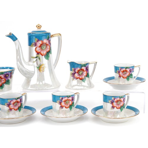 23 - Noritake porcelain coffee set hand coloured with flowers, the coffee pot 17cm high