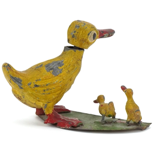 264 - Novelty hand painted metal nodding duck and chicks, 7cm high