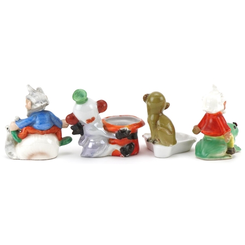 258 - Novelty bisque ornaments including ash pots, gnomes on frog, gnome on snail, monkey with top hat and... 