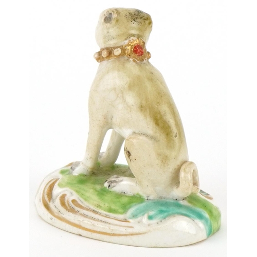 183 - 18th century Derby hand painted porcelain model of a pug on a cushion, 6cm high