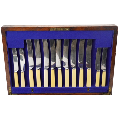 384 - Edwardian oak cased canteen of silver plated cutlery by Barker Brothers including a carving set