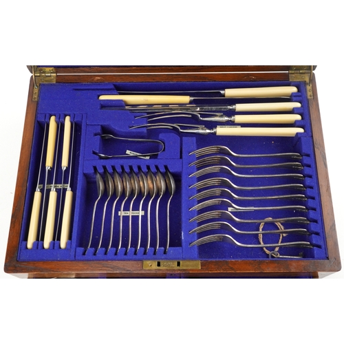 384 - Edwardian oak cased canteen of silver plated cutlery by Barker Brothers including a carving set