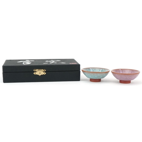 1104 - Pair of Japanese studio pottery footed bowls having crystalline type glazes, housed in a fitted box,... 