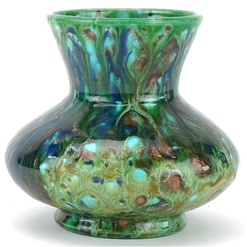 1128 - Art pottery vase having a mottled green and blue crystalline type glaze, 12.5cm high