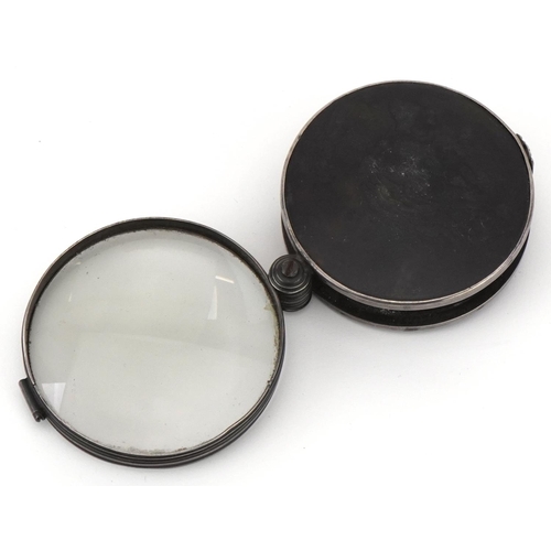 312 - 19th century unmarked silver and tortoiseshell folding magnifying glass, 6.5cm in diameter when clos... 