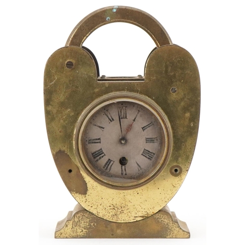 89 - Novelty brass clock in the form of a padlock with compass top, silvered dial and French movement, 20... 