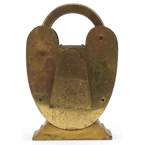 89 - Novelty brass clock in the form of a padlock with compass top, silvered dial and French movement, 20... 