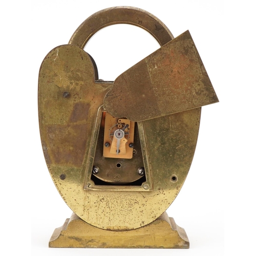 89 - Novelty brass clock in the form of a padlock with compass top, silvered dial and French movement, 20... 