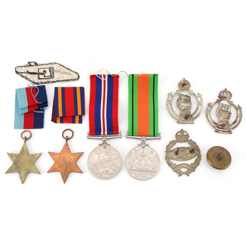 1510 - British Military interest World War II medals for Albert Edward Joyce, Tank Corps badges and patches