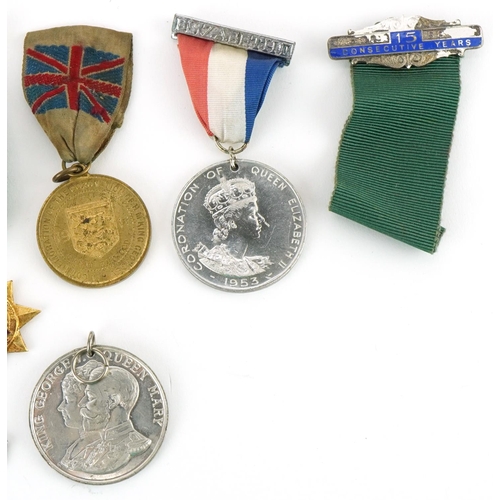 1337 - Five Coronation medallions, a 1955 driving award and a silver and enamel sports jewel