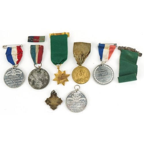 1337 - Five Coronation medallions, a 1955 driving award and a silver and enamel sports jewel